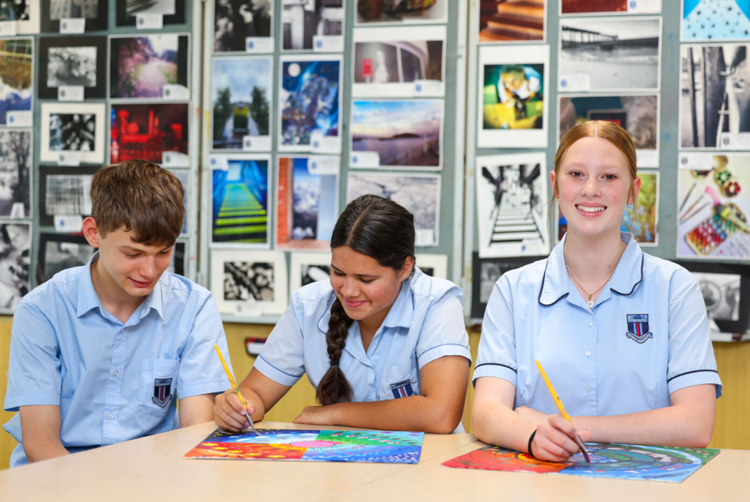 three students in art department