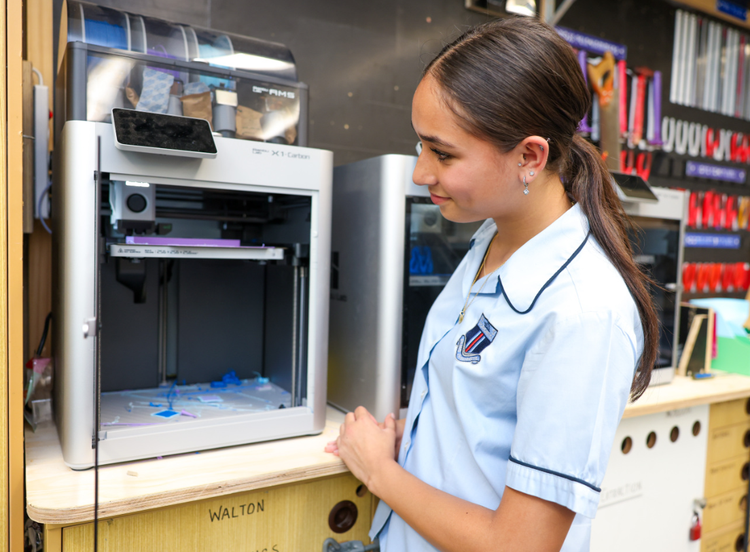 Student with laser cutter